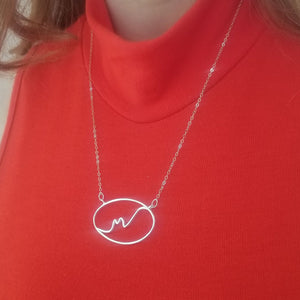 abstract yoga cat necklace on model