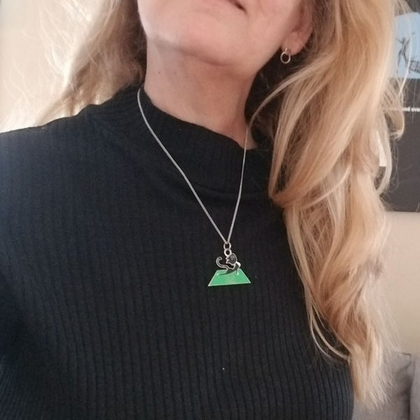 woman wearing yoga cat necklace
